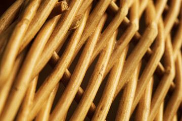 Brown willow twigs woven together with selective focus closeup