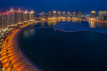 Beautiful blue hour Aerial view of Viva Bahria Pearl Qatar