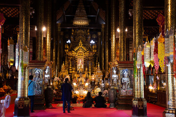 Interior decoration design ubosot ordination hall for thai people and foreign travelers travel visit respect praying in Wat Pa Daraphirom Temple at Mae Rim on December 2, 2020 in Chiang Mai, Thailand