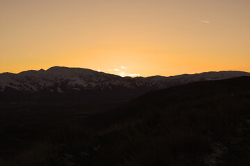 snowy mountains and red sky. sunset. view in Turkey.