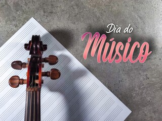 Dia do músico. Musician's day. Brazilian Portuguese Hand Lettering with violin and musical sheet.
