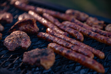 roasted chicken and pork steak with sausages. grilled meat cooked and smoked