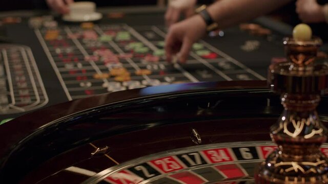 Roulette players place their bets