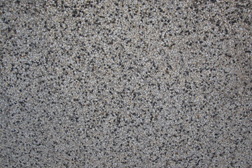 Rough textured wall made from black and white pebbles, abstract background, wall pattern, grunge rock backdrop