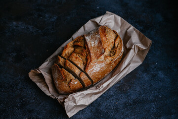 beautiful buckwheat bread on kraft paper on a dark background