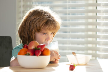 Kid drinking milk. Child nutrition. Child eating healthy food. Little boy with glass of milk. Healthy nutrition for kids.