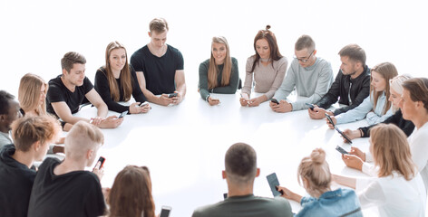 study group of young people sitting at a round table