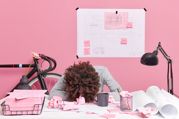 People working exhaustion deadline concept. Tired curly haired overworked woman leans at office...