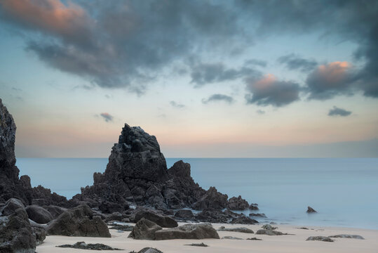 Stunning, vibrant sunrise landscape image of Barafundle Bay on Pembrokeshire Coast in Wales