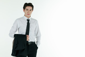 Portrait of self-confidence young and handsome Asian businessman executive looked put off and holding his jacket suit after work with relax pose, copy space studio shot isolated on white background