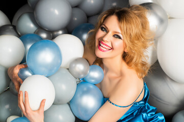 Obraz na płótnie Canvas Smiling woman with balloons. Celebration, party, holiday.