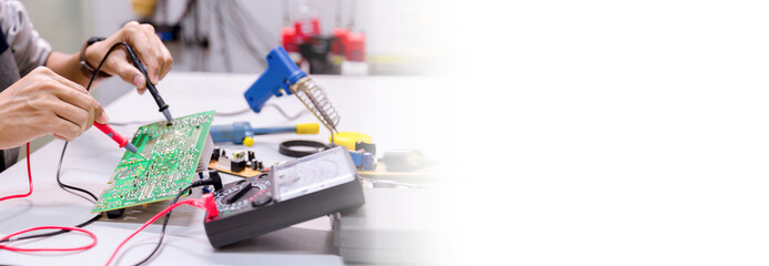 Close up of the hand men hold tool repairs electronics manufacturing Services,Repair of electronic devices, tin soldering parts.