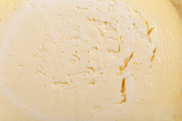 Up of cheesecake texture or surface in macro.