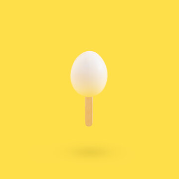 Creative Minimal Easter Concept With Boiled Egg On Ice Cream Stick 