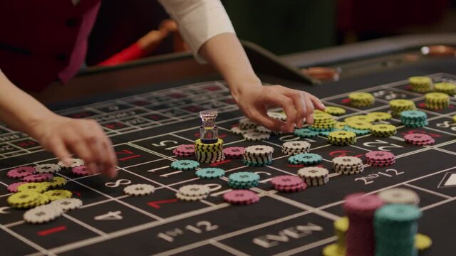 Croupier takes chips off table
