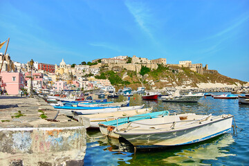 Fototapeta na wymiar Small boats in port on a Bay of Procida island, Naples, Italy