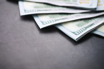 Group of money stack of 100 US dollars banknotes a lot of the background texture. Cash money in a large pile as a finance background.