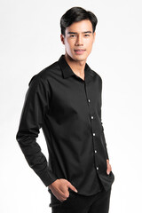 handsome confident young man standing and smiling in a black shirt. on white background.