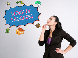 Financial concept about WORK IN PROGRESS with phrase on the side