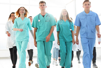 group of happy young medical professionals showing their success