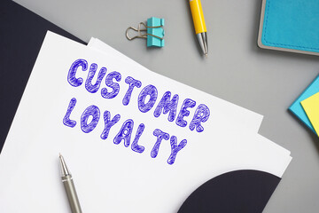 Business concept meaning CUSTOMER LOYALTY with sign on the sheet.