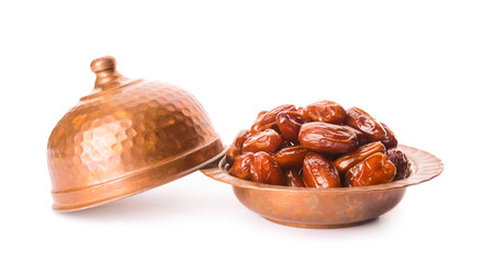 Bowl with sweet dried dates on white background