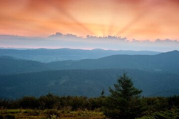 Fototapeta na wymiar Above the mountains morning, orange, glow of the rising sun.