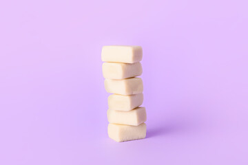 Fototapeta na wymiar Tasty chewing gums on color background