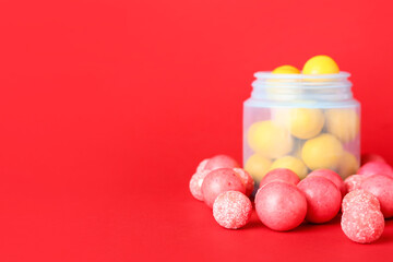 Jar with tasty chewing gums on color background