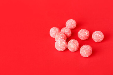 Tasty chewing gums on color background