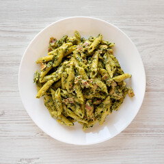 Homemade One-Pot Chicken Spinach Bacon Alfredo Pasta Ready to Eat, overhead view. Flat lay, top view, from above.