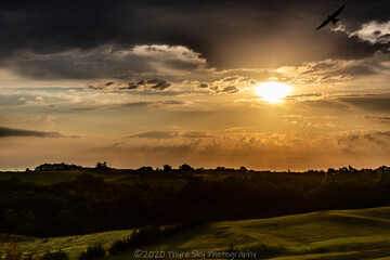 Rural landscape with clouds at sunset 
