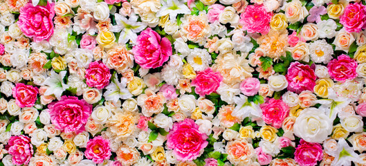 Background Flowers. Pano of artificial flowers. delicate palette, bright, multi-colored, rich color
