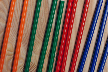 multicolored pencils object on work table wooden background office close-up