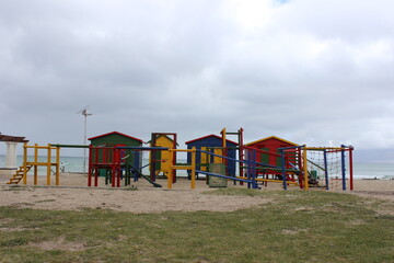 Fototapeta na wymiar colorful changing rooms in St James beach Muizenberg Cape Town south Africa
