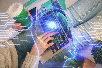 Double exposure of woman hands working on computer and brain hologram drawing. Ai concept.