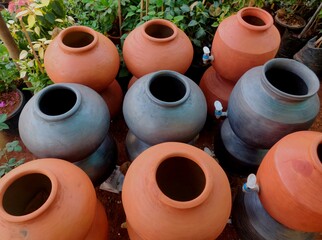 A clay water pot earthen pot for water storage Clay pots not only cool the water down, they also provide healing with the elements of earth.