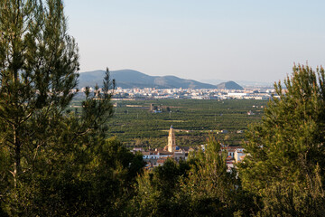 Landscape of the La Safor region of Valencia (Spain) with views of the bell tower and the town of L 'Alqueria de la Comtessa.