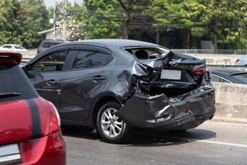 Black car get damaged by accident on the road. concept of road safety.