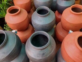 A clay water pot earthen pot with tap for water storage Clay pots not only cool the water down, they also provide healing with the elements of earth.