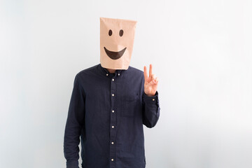 person with paper bag on head with a smile, happy success concept