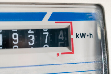 macro view of electricity watt meter, kilowatt calculator counter at home, savings economy