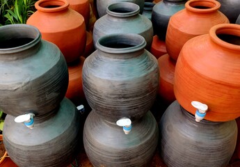 A clay water pot earthen pot with tap for water storage Clay pots not only cool the water down,...