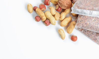 Mixture of nuts with buckwheat bags. The concept of proper nutrition and diet.
