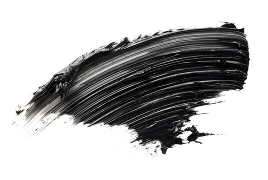Smudged black mascara isolated on white background. Cosmetic product swatch. Paint brush stroke