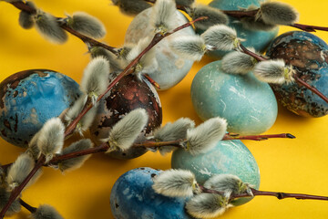 Easter background with colorful easter eggs isolated on yellow background. 