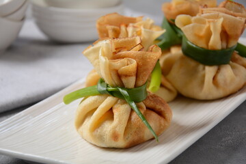 Chicken-Filled Crepe Party Purses. Pancakes rolled into a bag and stuffed with chicken meat