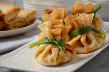 Chicken-Filled Crepe Party Purses. Pancakes rolled into a bag and stuffed with chicken meat