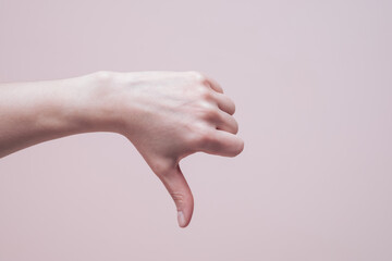 Thumb down gesture. Hand signs communication concept