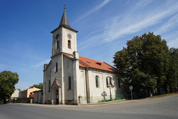 Fototapeta na wymiar Historic church on main road, Prerov nad Labem, Czech Republic
